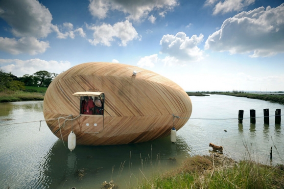 Traveling-Down-The-River-In-This-Egg-Boat-1