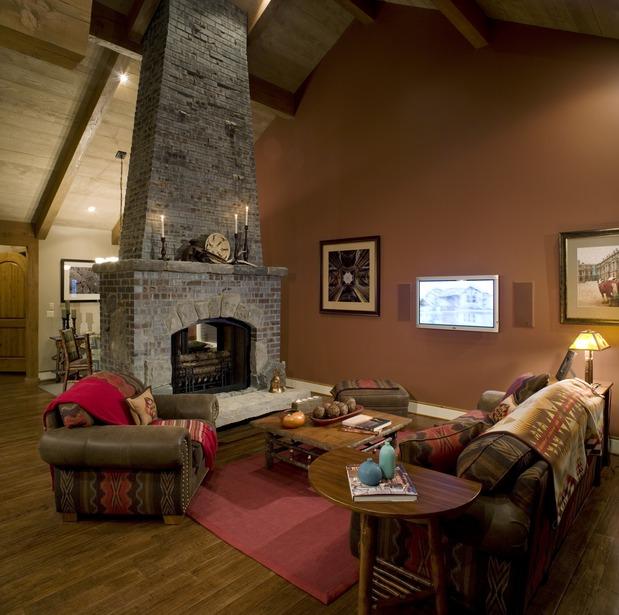 Cozy Living Room With A Stone Fireplace