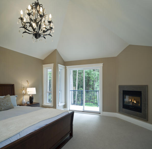 Bedroom With Built-In Fireplace