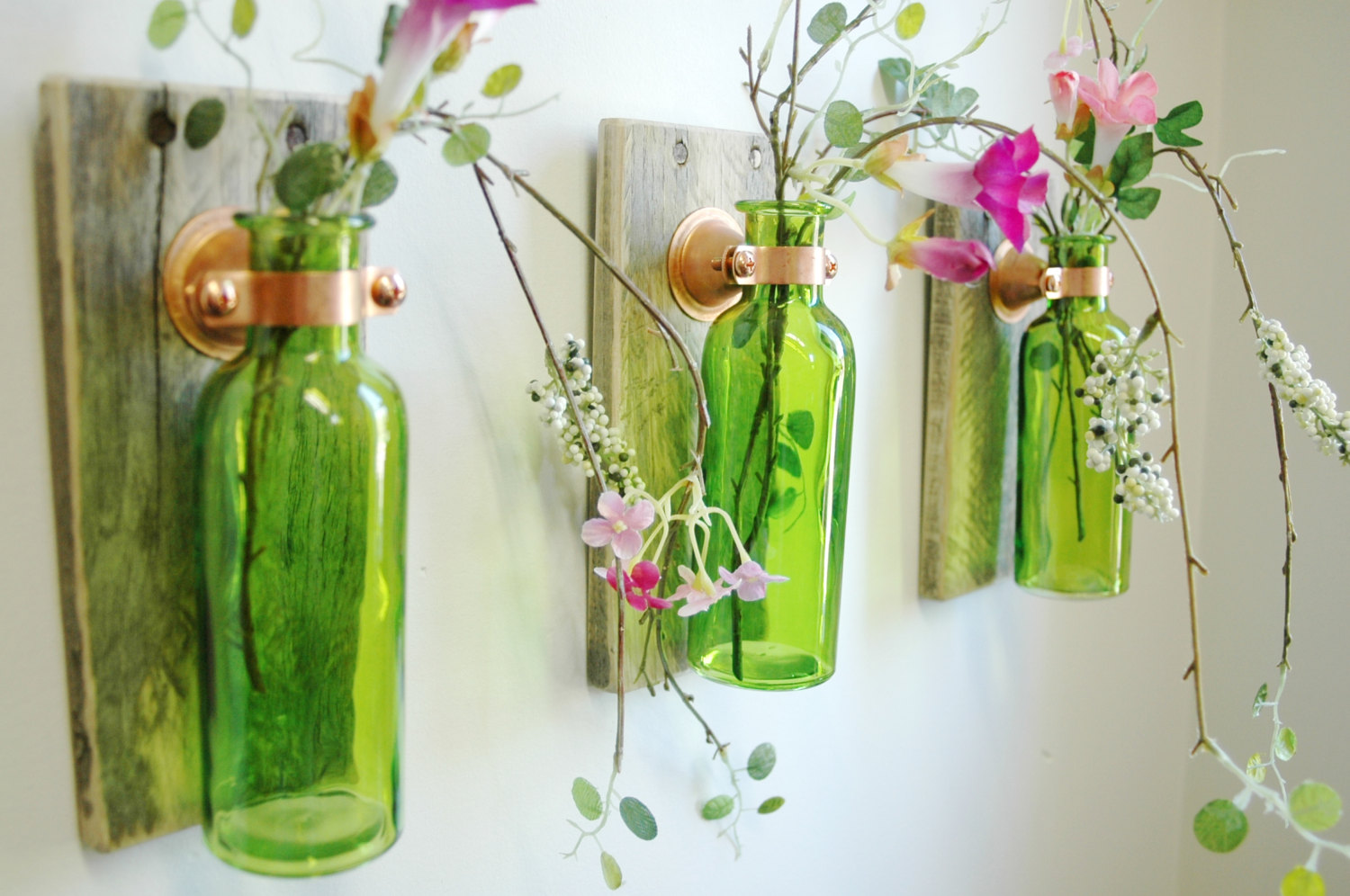 Wall decoration with green bottles