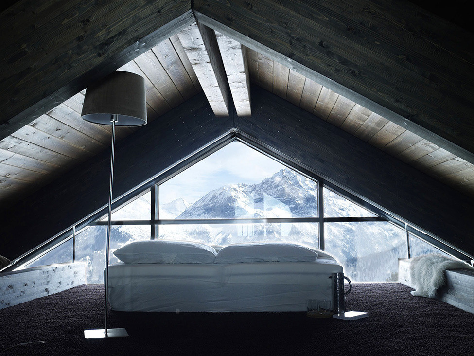 Attic Bedroom With Glass Wall And Mountain View