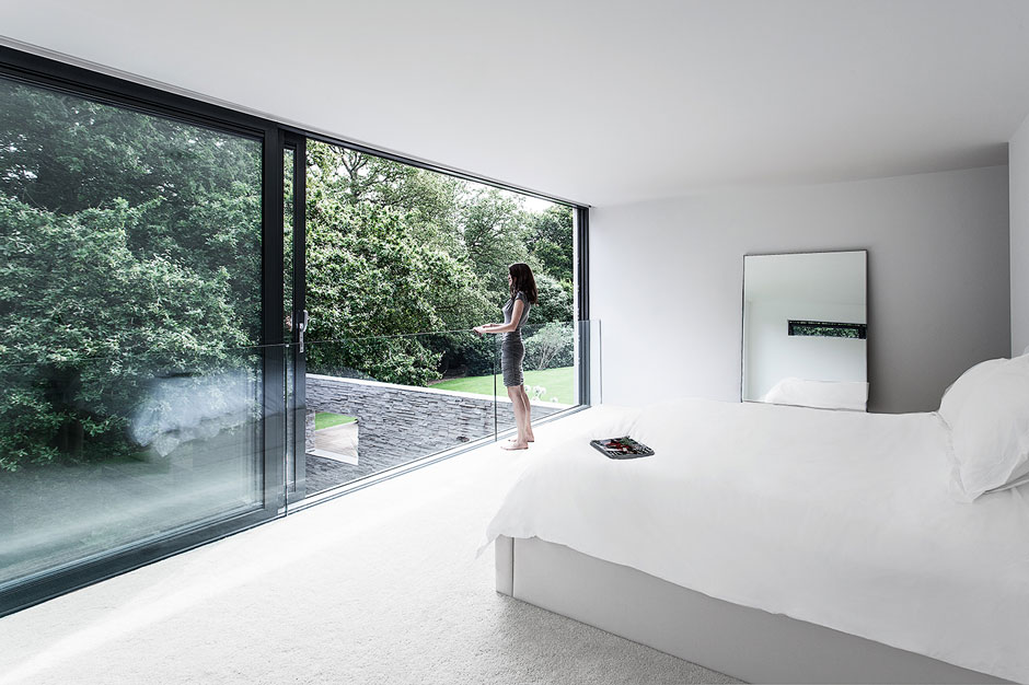 Minimalist White Bedroom With A Glass Wall