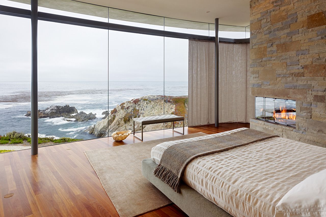 Bedroom With Floor-To-Ceiling Glass Wall And Ocean View