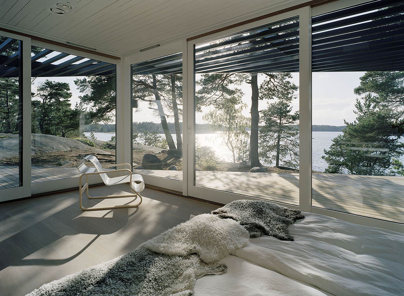 Bedroom With A Glass Wall And Sea View