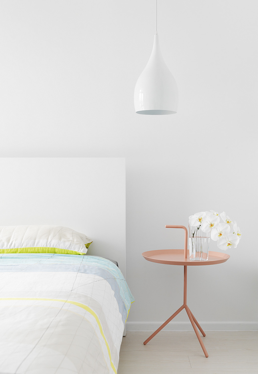 White Bedroom With A Pastel Nightstand