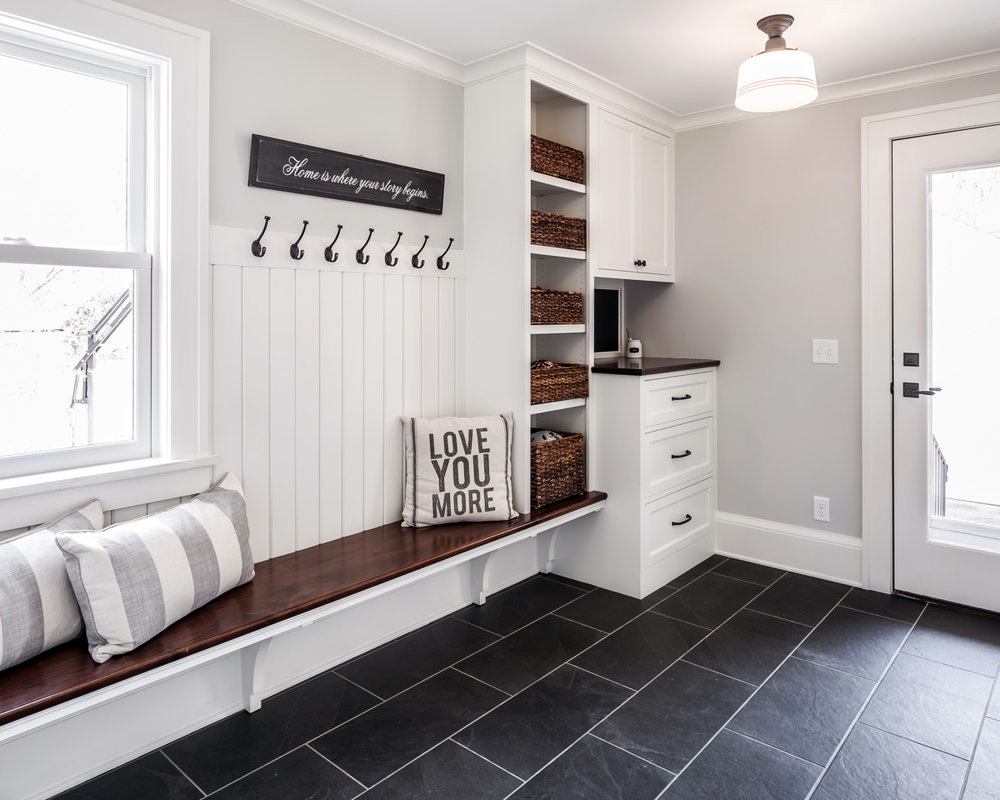 Spacious Entryway In White And Wood