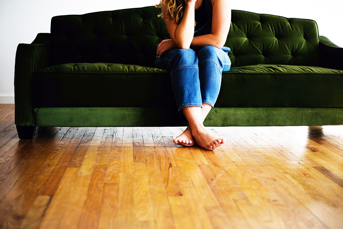 Green Couch And Wooden Floor