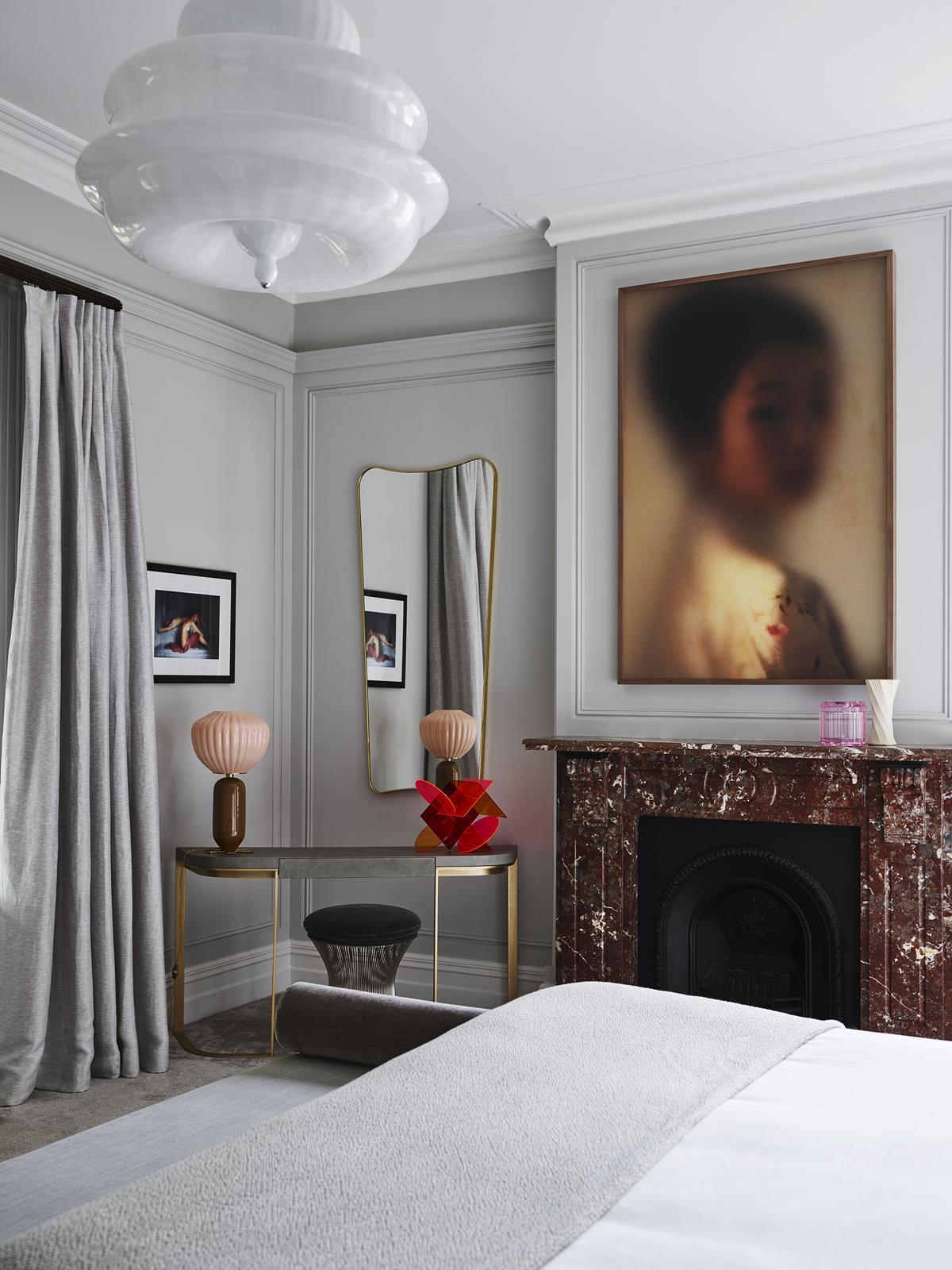 Bedroom With A Marble Fireplace