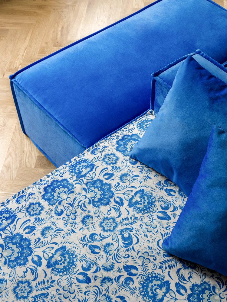 Blue Couch With Floral Elements
