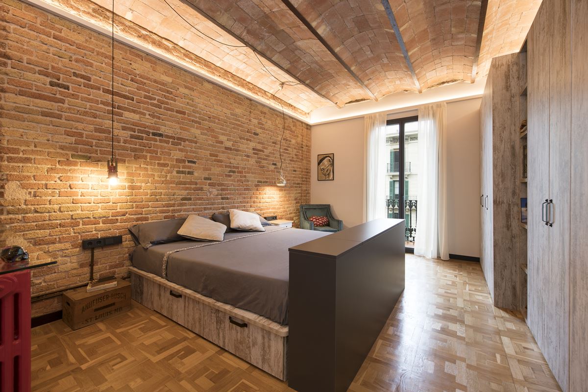 Bedroom With A Brick Wall