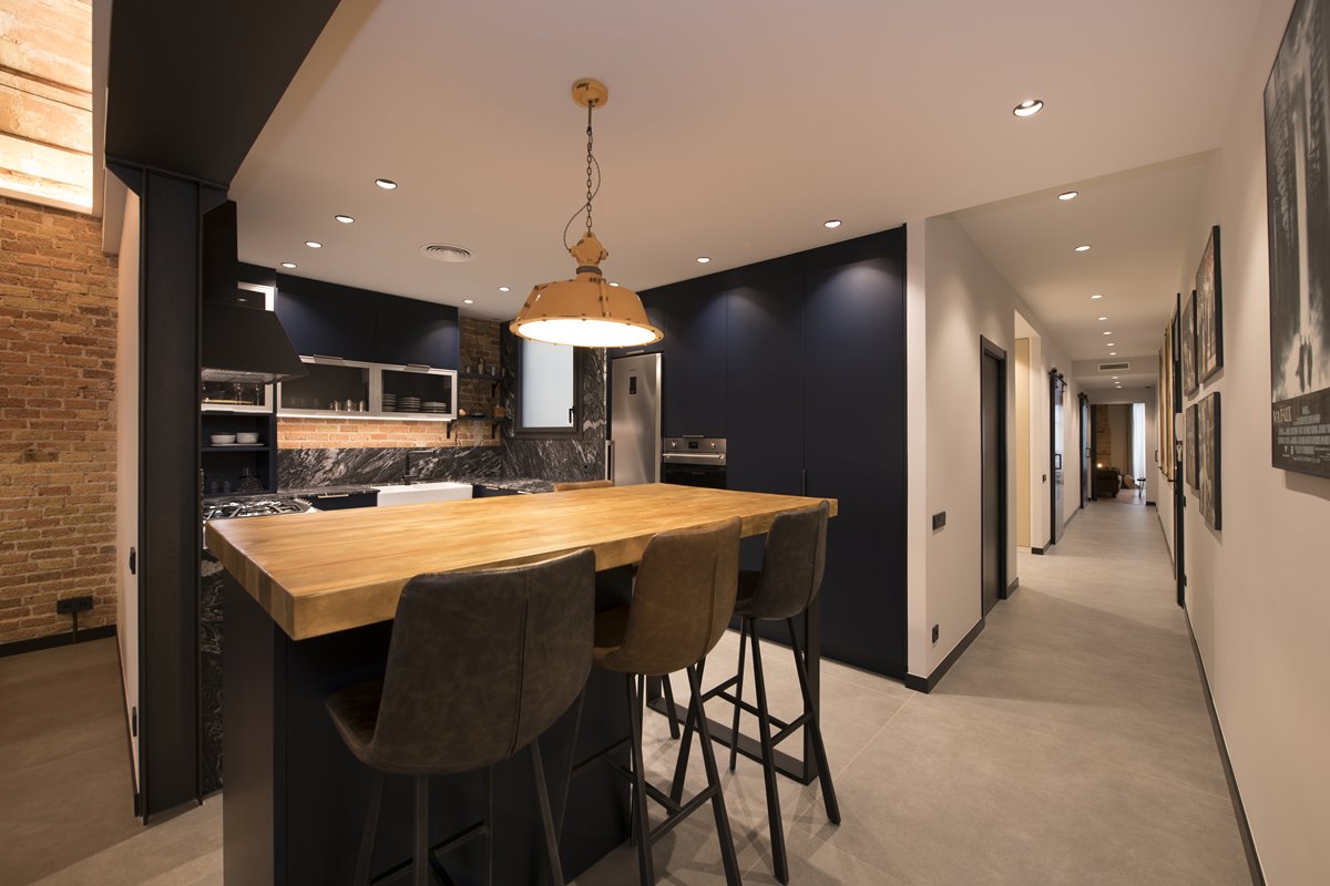 Industrial Kitchen With A Bar Table